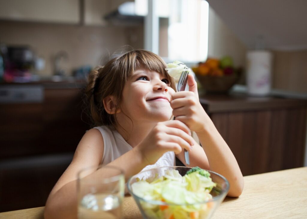 child eating salad, autism support